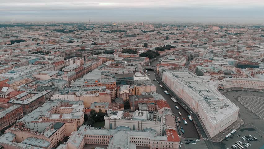 SAINT-PETERSBURG, RUSSIA - JUNE, 2023: Aerial sideways Petersburg central historical cityscape overall plan. Winter palace square Hermitage, Admiralty, St. Isaac's Cathedral. Neva river ships sail.