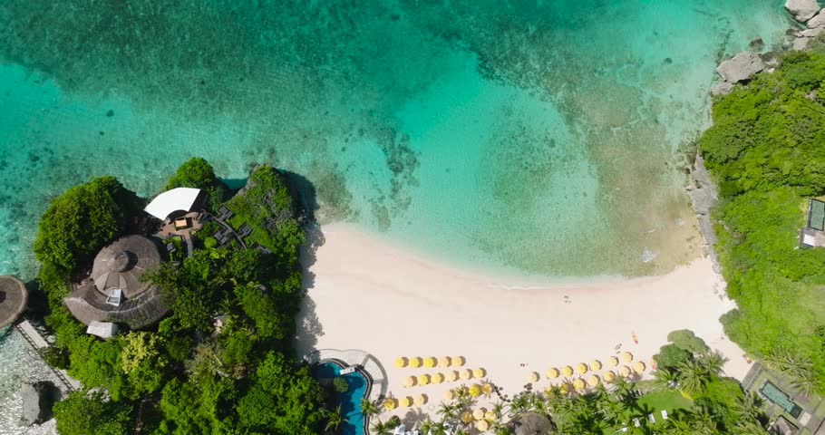 Sun reflection over turquoise water and white sand in beach resorts. Boracay, Philippines.