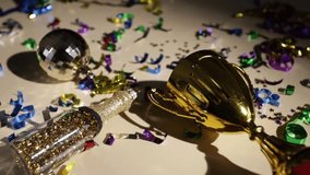 Golden trophy, celebratory champagne with confetti, winning atmosphere,disco ball sparkles - Powered by Shutterstock - Get 15% off with code: PIKWIZARD15