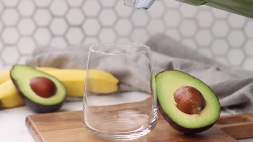 Avocado Smoothie - Healthy Drink, Weight Loss, High in Fiber, Vitamins and Minerals, Fruit Smoothie, Avocado, Creamy Blend of Avocado, Fresh Fruits, Nut Milk - Deliciously Nourishing and Refreshing. Royalty-Free Stock Footage #3440582975