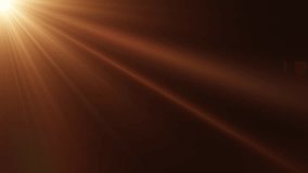 Loop of rays glow orange gold optical flare shine  light from the top left animation on black abstract background for screen project overlay. Side diagonal light optical lens flares shiny animation ar - Powered by Shutterstock - Get 15% off with code: PIKWIZARD15