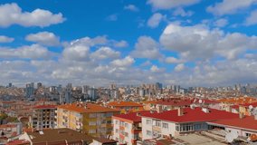 Timelapse: fast moving white clouds in the blue sky over typical turkish apartment, residential buildings in Istanbul - afternoon, daylight. Cityscape, architecture and time lapse concept - Powered by Shutterstock - Get 15% off with code: PIKWIZARD15