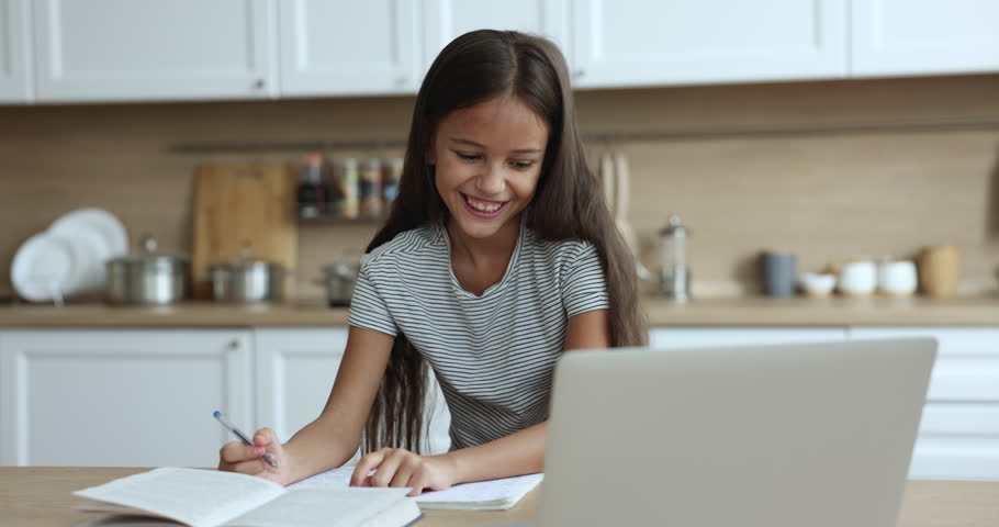 Beautiful schoolgirl studying with on-line tutor, makes assignment using laptop and videocall application. Pretty girl talks to teacher, discuss school task, take part in class. Education, modern tech Royalty-Free Stock Footage #3440886949