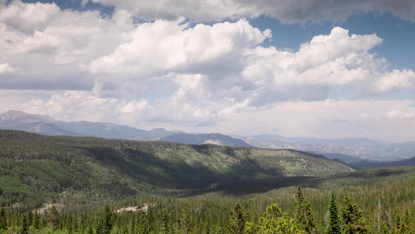 Timelapse high angle shot of storm clouds moving over the Colorado Rocky Mountains, in Rocky Mountain National Park USA