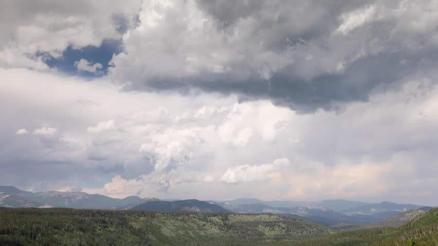 Timelapse high angle shot of storm clouds moving over the Colorado Rocky Mountains, in Rocky Mountain National Park USA