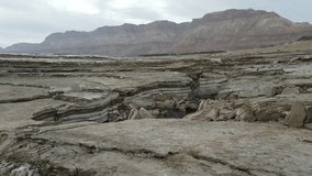 And aerial diving over sinkholes and landslides in the Dead Sea, the lowest place in the world. Israel