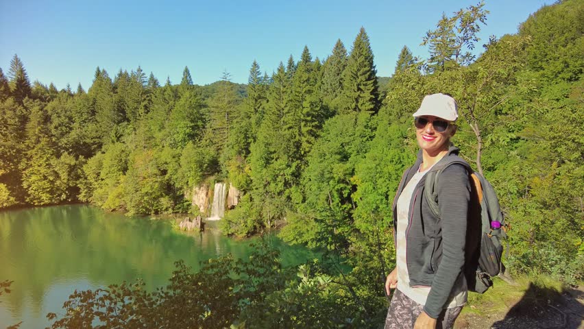 Proscansko Lake Proscansko Jezero viewpoint: backpacker woman in the Plitvice Lakes National Park of Croatia. Natural forest park with lakes and waterfalls in Lika region. UNESCO World Heritage site