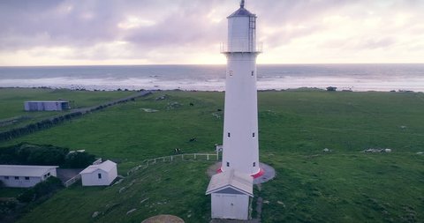 aerial: Cape Egmont lighthouse and farmland Mt Taranaki / Mt Egmont, New Zealand
