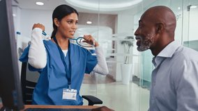 Female doctor or nurse wearing scrubs examining mature male patient listening to his chest with stethoscope - shot in slow motion - Powered by Shutterstock - Get 15% off with code: PIKWIZARD15