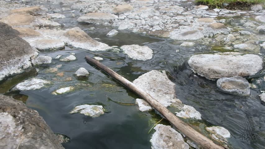Hot springs with rocks and green jungle.Fang Hot Spring, Chiang Mai Province,Thailand 