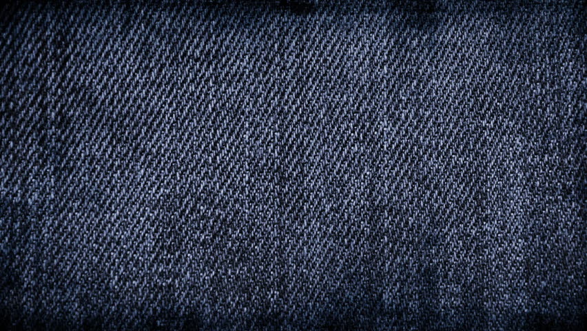 Stylish dark blue denim texture stop-motion background loop with scratches, worn details, and fashionable close-ups, perfect for a trendy and grunge inspired fashion or design project.