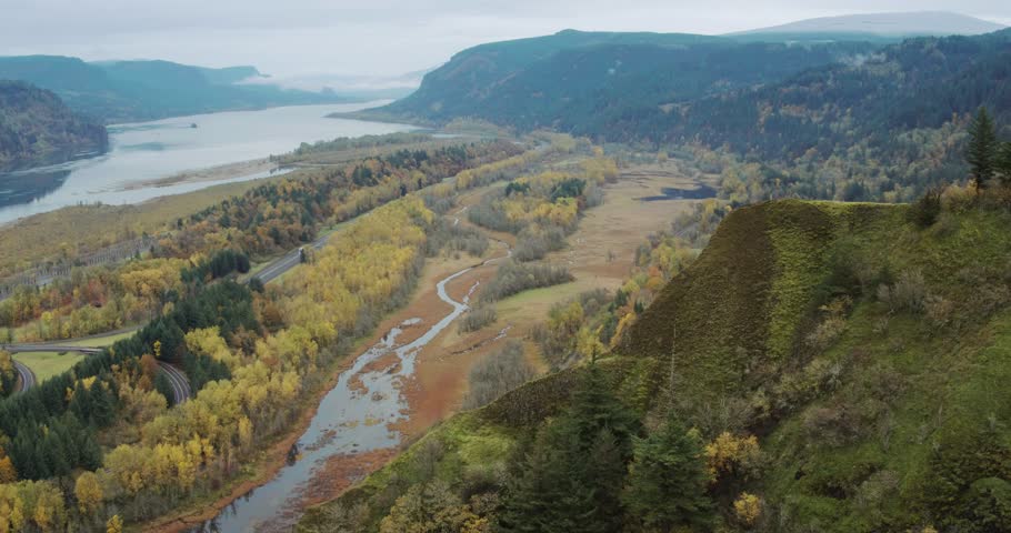 Aerial: the Columbia River and forests during Autumn. Portland, Oregon 