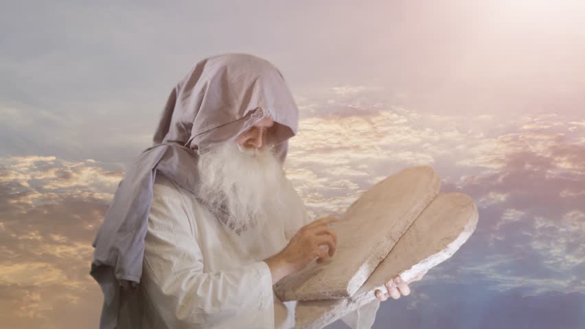 
The Old Testament biblical prophet Moses holds the tablets with the ten commandments