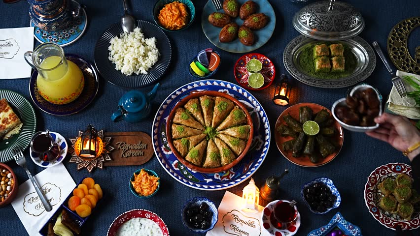 Ramadan Iftar Table.Muslim Family Having Dinner At Home.Iftar Table Turkish Traditional Food.Fasting ends with Dates.Ramadan Feast Celebrations, Eid Mubarak Concept Video, Uskudar Istanbul, Turkiye  Royalty-Free Stock Footage #3441675651
