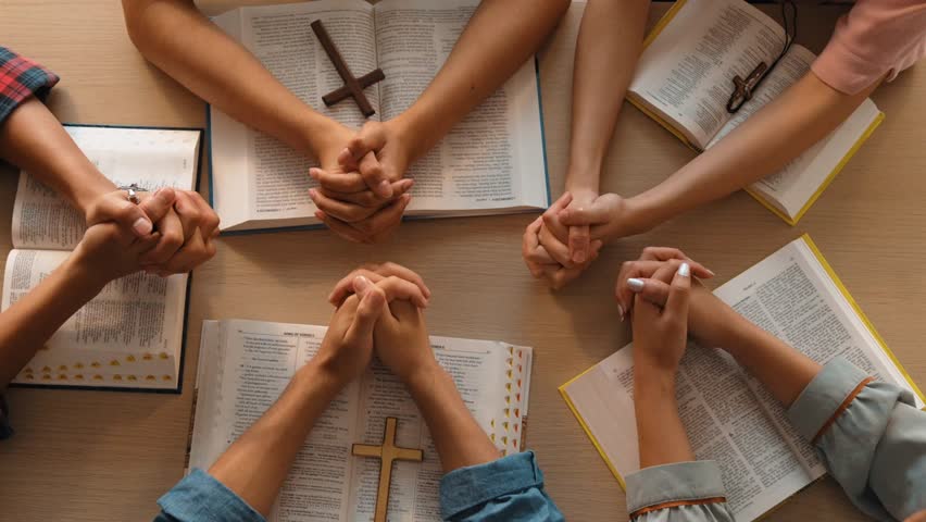 Sense of devotion and spiritual fulfill with christian catholic follower immerse in faith. Slow motion christian people practicing group prayer, holding hand while praying together. Burgeoning Royalty-Free Stock Footage #3441796727