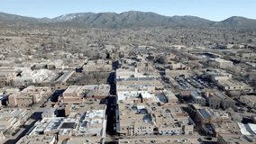 Downtown Santa Fe, New Mexico with drone video wide shot moving down.