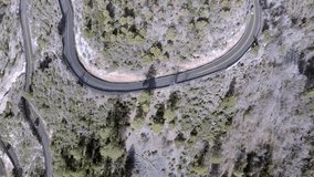 Switchback road with cars driving on Highway 89 A in Sedona, Arizona with drone video overhead moving forward.
