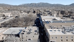 Downtown Santa Fe, New Mexico with drone video wide shot moving up.