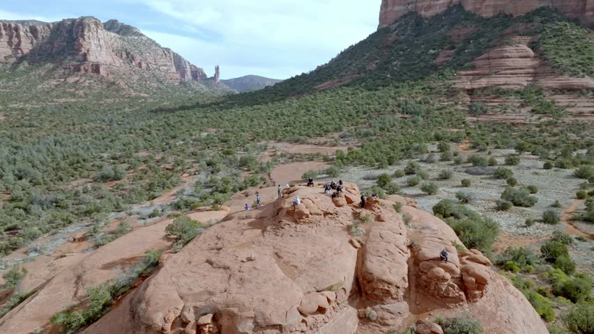 Buttes in Sedona, Arizona with people on top and drone video moving in a circle. Royalty-Free Stock Footage #3441838939