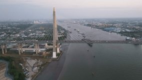 Aerial video footage of Kanchanaphisek Bridge by panning the camera to the right, parallel to the bridge. To see the evening traffic in Thailand
