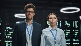 Smiling colleagues posing data center closeup. Successful happy software engineers looking camera at tech office portrait. Positive woman crossed arms standing with teammate at dark room zoom on - Powered by Shutterstock - Get 15% off with code: PIKWIZARD15
