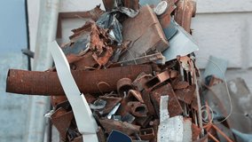 rusty scrap metal in an iron barrel - Powered by Shutterstock - Get 15% off with code: PIKWIZARD15