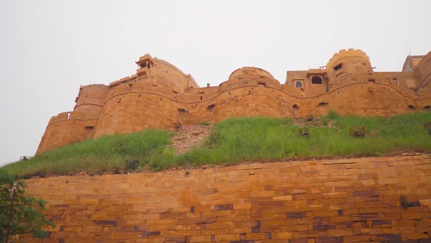 Beautiful historical Jaisalmer fort wall and buildings at Rajasthan, India. Concept of tourism. Ancient Indian architecture. Fort made of yellow sand stone. 