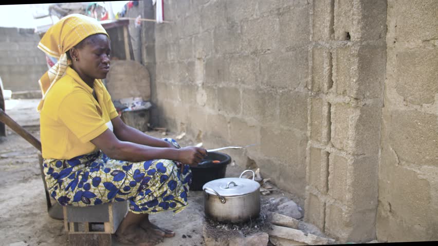 24th December 2023,gwalada Nigeria:African women preparing local traditional meal in a rural area.rustic pot on open fire cooking hot food.traditional cooking stove with wood
