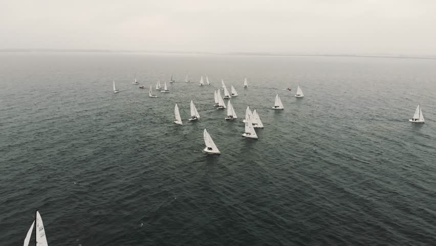 Sloop sailboats race into headwinds on Lake Constance Royalty-Free Stock Footage #3442230381
