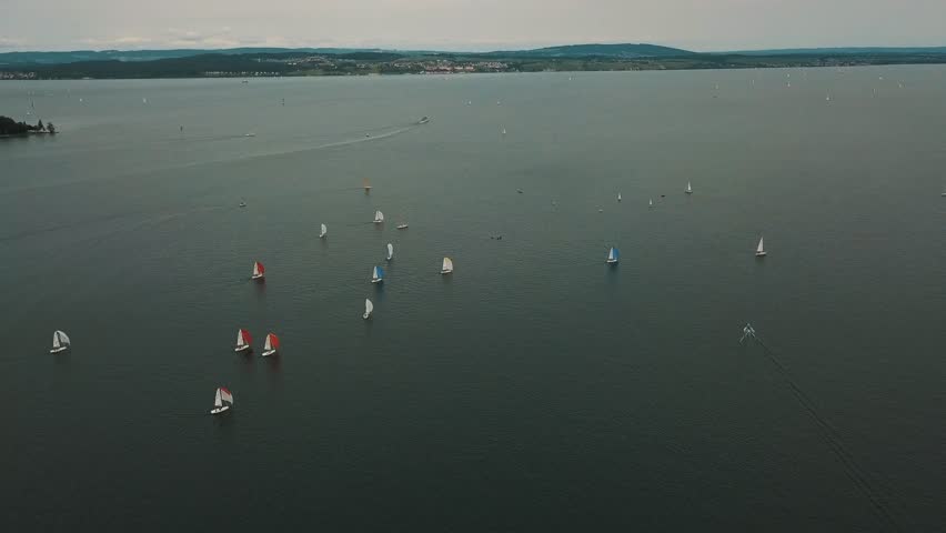 Wind fills the sails of sloops racing in an annual regatta in Germany Royalty-Free Stock Footage #3442240735