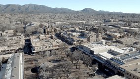 Downtown Santa Fe, New Mexico with drone video wide shot moving in a circle move.