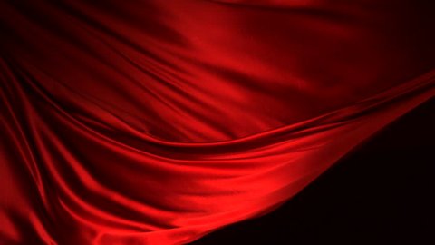 Red silk fabric flying in the air shooting with high speed camera, phantom flex.