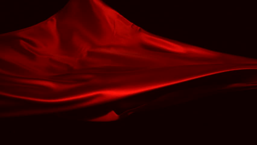 Red silk fabric flying in the air shooting with high speed camera, phantom flex.