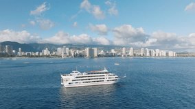 Tourist attraction on cruise boat with dining and entreatment show. White ship sailing with Honolulu and Diamond head views. Sunset cruise along Waikiki shore on Oahu island. Hawaii tourism background