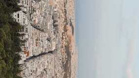 Vertical video. Athens, Greece. Acropolis of Athens in the light of the morning sun. Summer, Aerial View