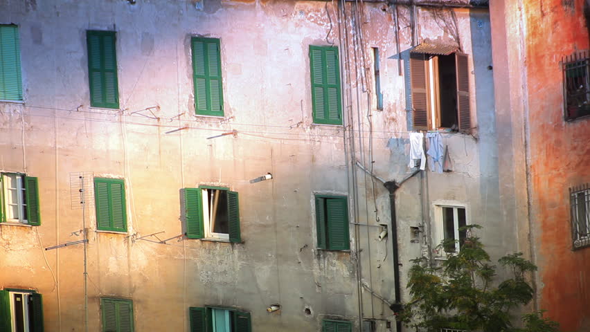 Shot of numerous windows of a residential building in Italy