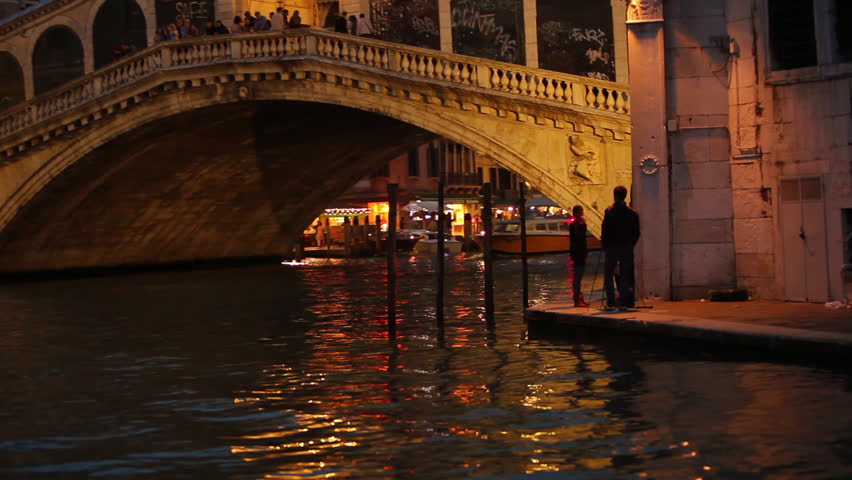 Floating near people up to a bridge in Venice Italy