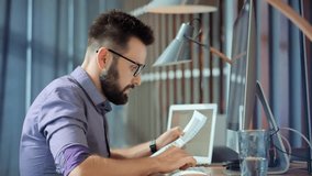 Salesman Analyzing Charts On Laptop. Focused Trader Reading Corporate Financial Audit Report Document. Serious Online Trader Work Stock Market Data. Businessman Lawyer Working In Office On Workplace - Powered by Shutterstock - Get 15% off with code: PIKWIZARD15