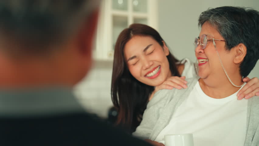 mother day family relation bonding at home asian family mother father and daughter enjoy cuddle conversation morning lifestyle hapiness joyful moment while stay at kitchen area home love bonding