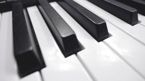 Musical keyboard, dolly shot. Black and white piano keys, view from above - Powered by Shutterstock - Get 15% off with code: PIKWIZARD15