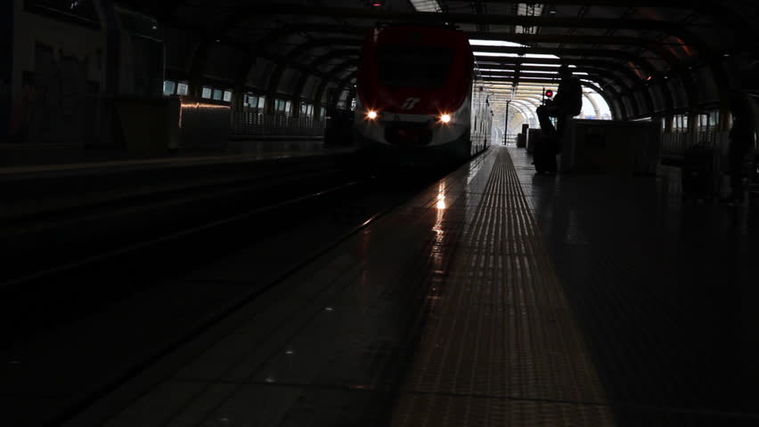 Train comes to a stop at a platform