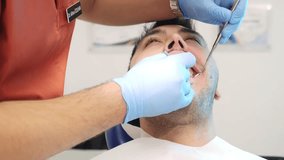 Close-up video of a male patient's dental examination