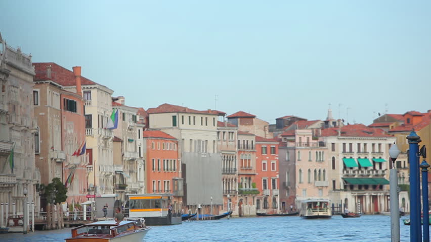 Shot of venetian buildings on the edge of the canal. The buildings all have