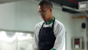 Cooking class. portrait asian thai male professional chef cooking meal. culinary classroom. cooking school.  lessons in a cooking school - Powered by Shutterstock - Get 15% off with code: PIKWIZARD15