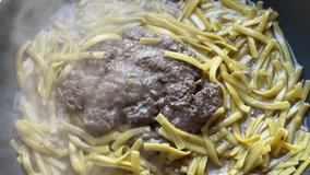 Meatballs Burger is cooking with egg Italian noodles Macro Detail shot 4K video healthy lifestyle protein carbohydrates buying now