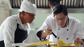 Mature master chef and student. Cooking class. portrait senior asian thai male professional chef cooking meal. culinary classroom. cooking school. lessons in a cooking school.  - Powered by Shutterstock - Get 15% off with code: PIKWIZARD15