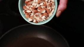 nutty delight: roasted almonds in a pan