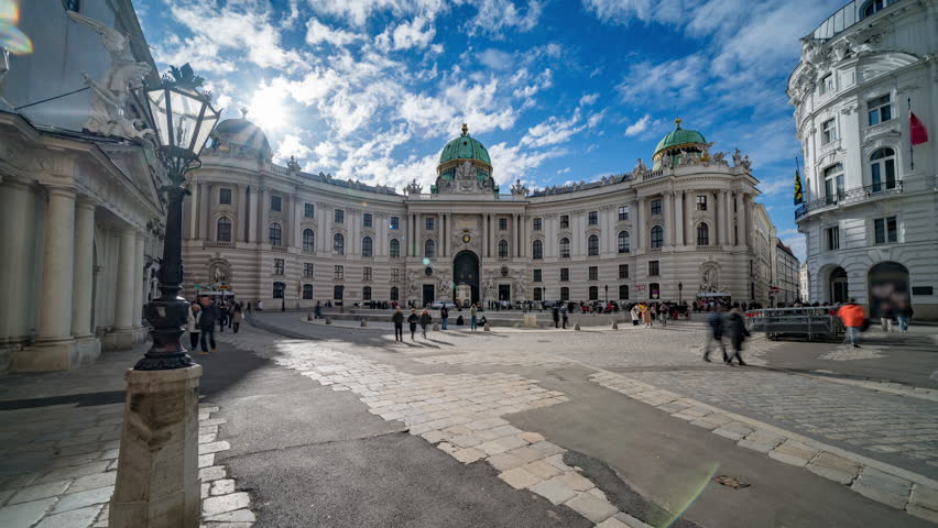 Hofburg palace timelapse hyperlapse in Vienna, Austria. People walking on Michaelerplatz. The Hofburg is the imperial palace of the Habsburg rulers in Vienna. Sisi Museum Hofburg Wien
