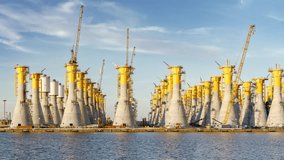 Construction of gravity-based structures (GBS), engineered for offshore wind farms, each one will be moved offshore and will be the base for a giant wind turbine - Powered by Shutterstock - Get 15% off with code: PIKWIZARD15