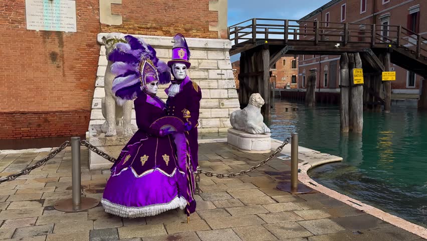 Venice Carnival. People in Venetian carnival masks and costumes on streets of Venice, Italy, Europe February 10, 2024. High quality 4k footage